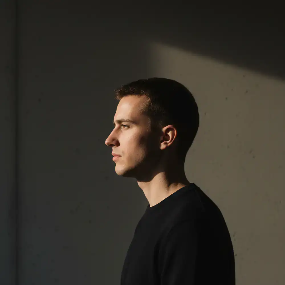 Profile portrait with stark contrasting shadows